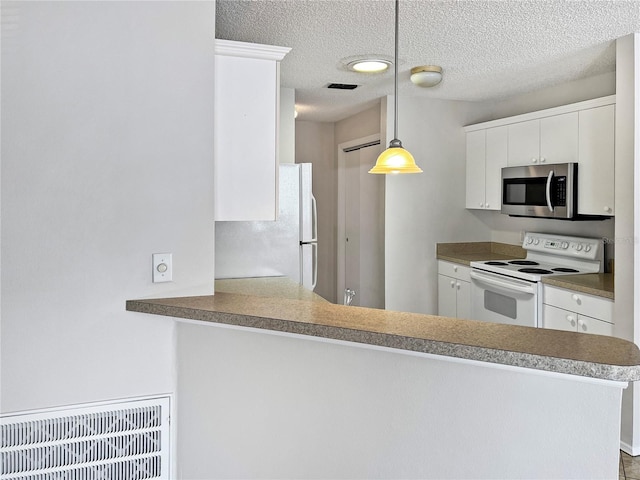 kitchen with white cabinetry, a textured ceiling, kitchen peninsula, pendant lighting, and white appliances