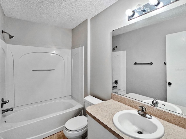 full bathroom with bathing tub / shower combination, vanity, a textured ceiling, and toilet