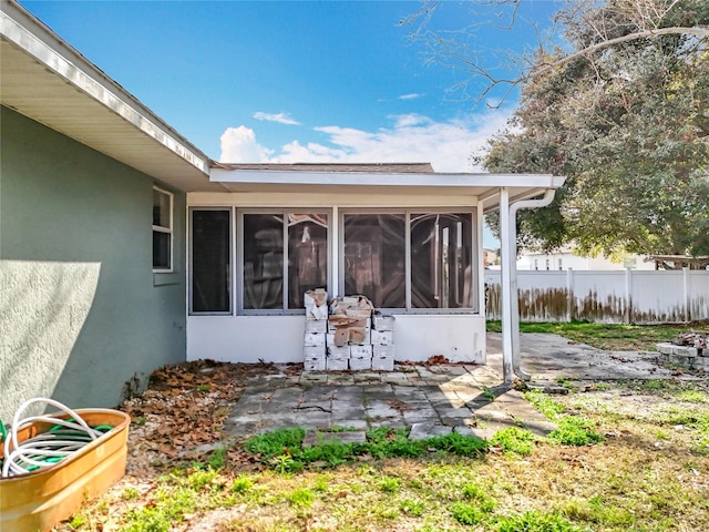 view of patio / terrace featuring a sunroom