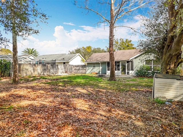 back of house with a yard