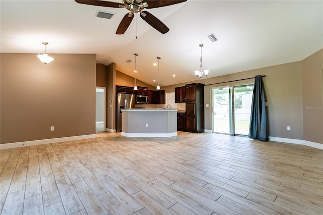 unfurnished living room with a ceiling fan, lofted ceiling, light wood-style flooring, baseboards, and a chandelier