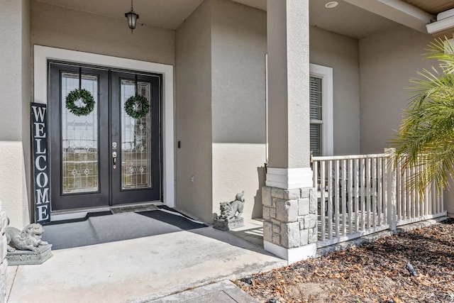 property entrance featuring french doors