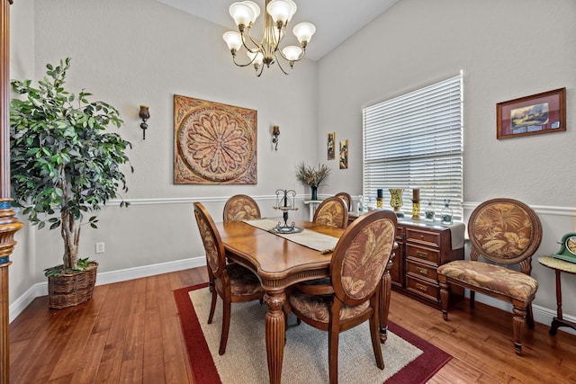 dining space featuring an inviting chandelier and light wood-type flooring