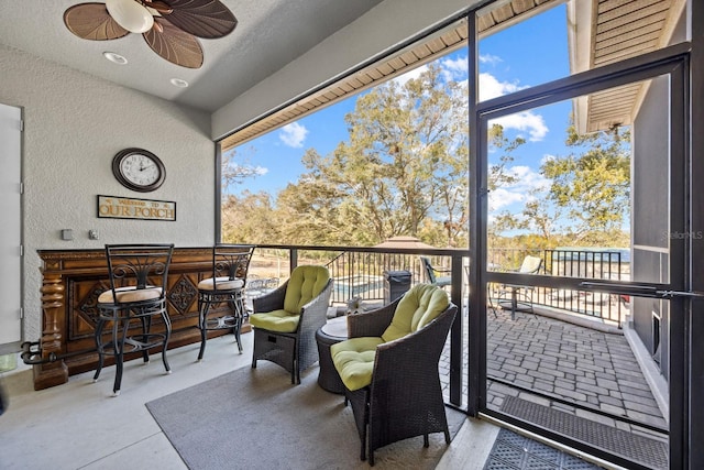 balcony featuring ceiling fan