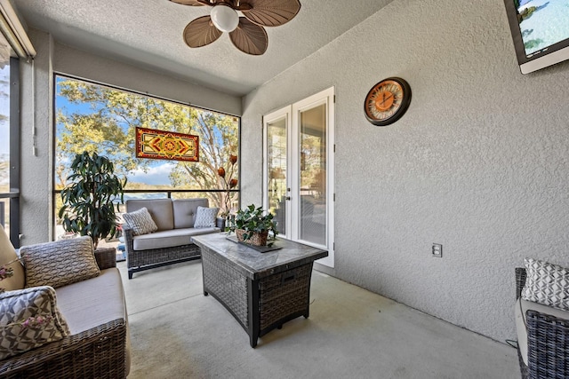 sunroom featuring plenty of natural light and ceiling fan