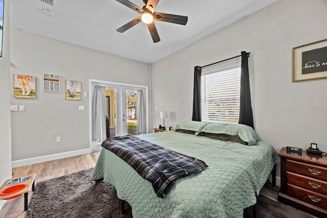 bedroom featuring hardwood / wood-style floors, access to outside, ceiling fan, and french doors