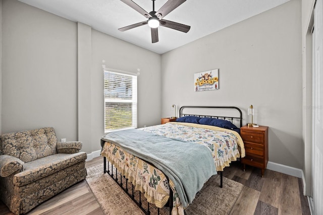 bedroom with hardwood / wood-style floors and ceiling fan