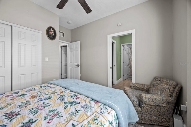 bedroom with wood-type flooring, a closet, and ceiling fan