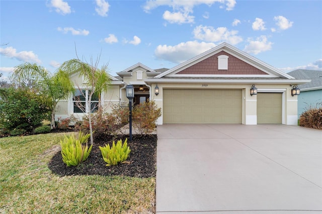 view of front of home with a garage and a front yard