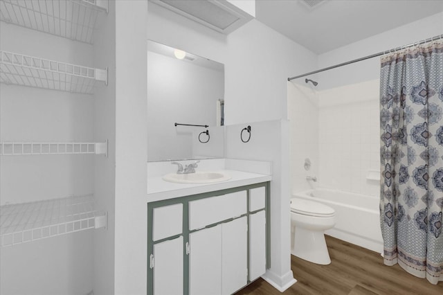 full bathroom featuring vanity, hardwood / wood-style floors, shower / bath combination with curtain, and toilet