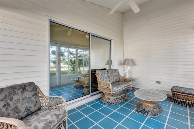 view of patio featuring ceiling fan