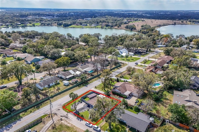 bird's eye view featuring a water view and a residential view