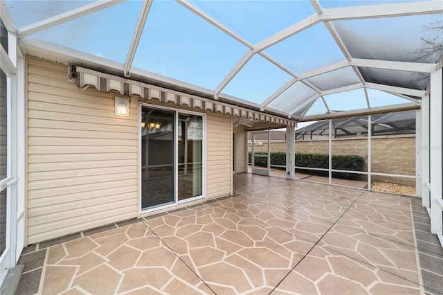 unfurnished sunroom featuring lofted ceiling