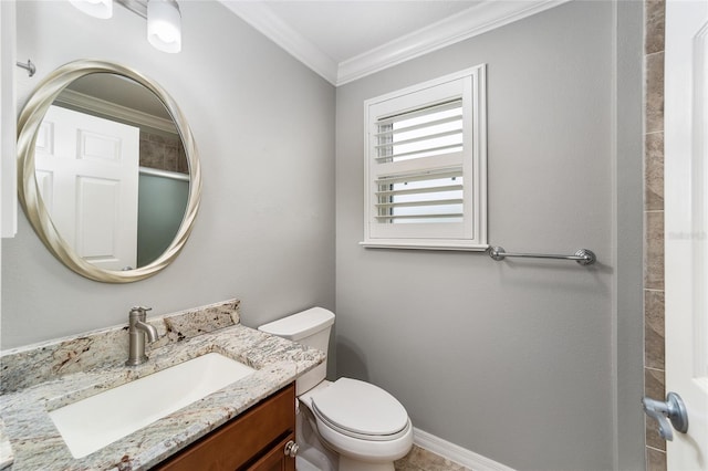 bathroom featuring vanity, ornamental molding, and toilet