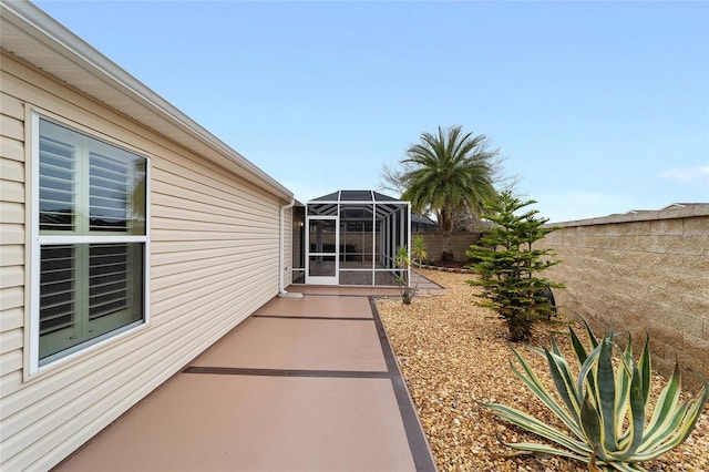 view of patio / terrace with glass enclosure