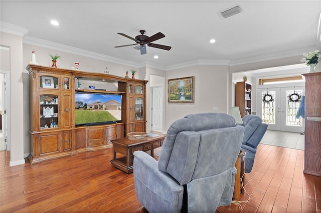 13914 SE 96th Cir, Summerfield, FL 34491 - living room featuring ornamental molding, hardwood / wood-style floors, ceiling fan, and french doors