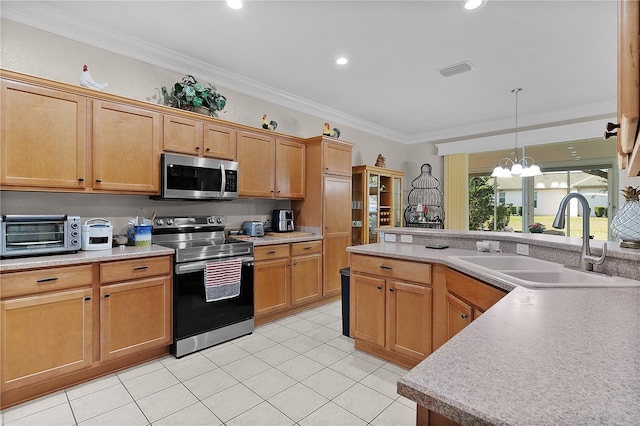 13914 SE 96th Cir, Summerfield, FL 34491 - kitchen featuring light tile patterned flooring, appliances with stainless steel finishes, sink, hanging light fixtures, and crown molding