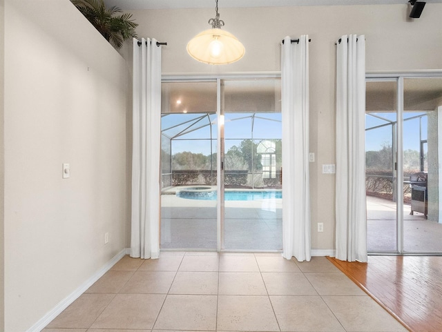 doorway featuring light tile patterned floors