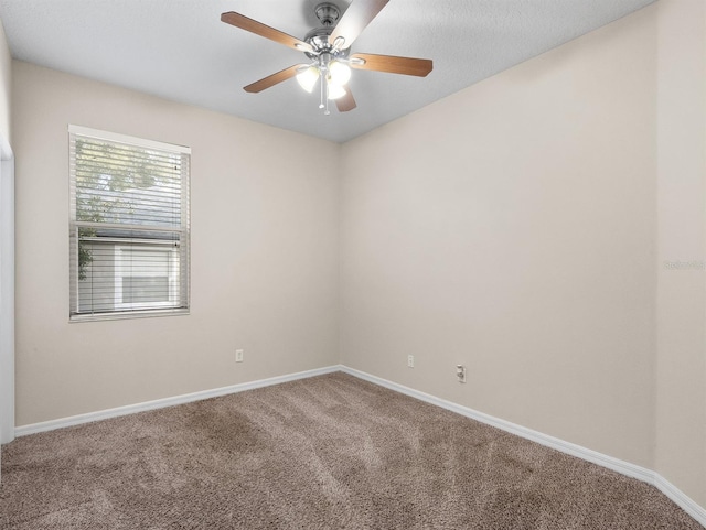 carpeted empty room with ceiling fan