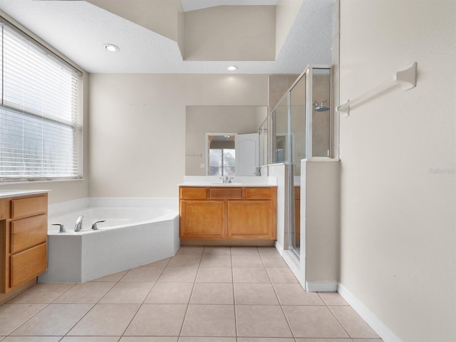 bathroom with vanity, independent shower and bath, and tile patterned flooring