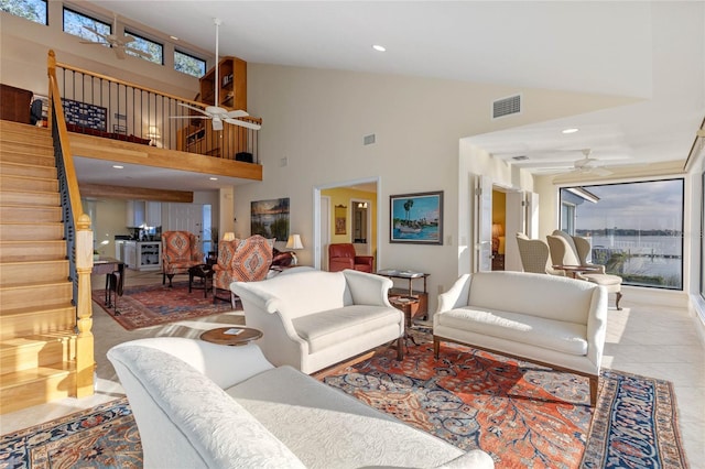 tiled living room with ceiling fan