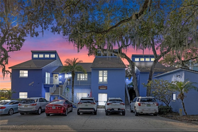 view of outdoor building at dusk