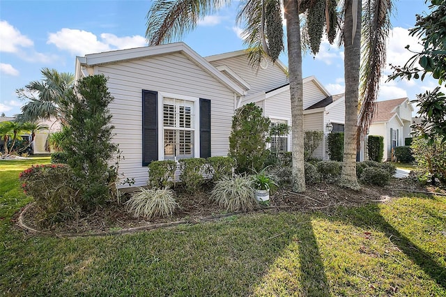 view of home's exterior featuring a yard