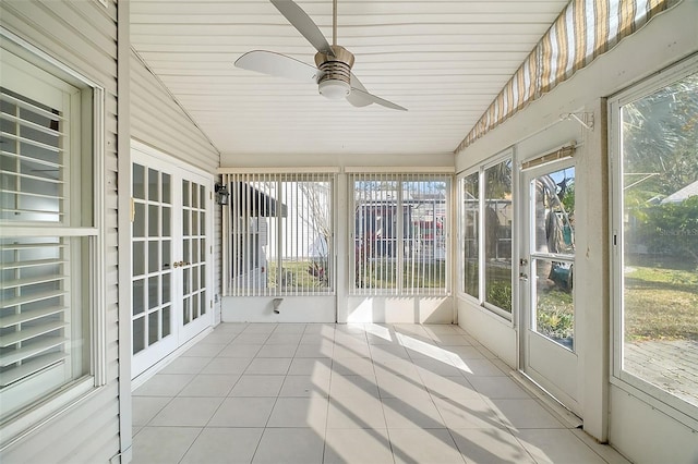 unfurnished sunroom featuring lofted ceiling and ceiling fan