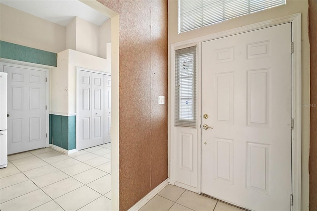 foyer entrance featuring light tile patterned floors