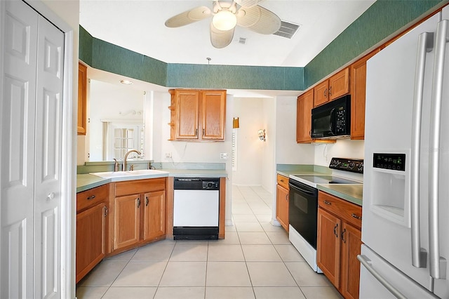 kitchen with ceiling fan, sink, light tile patterned floors, and white appliances