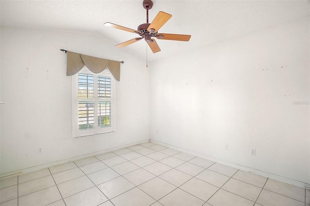 empty room featuring lofted ceiling, a textured ceiling, and ceiling fan