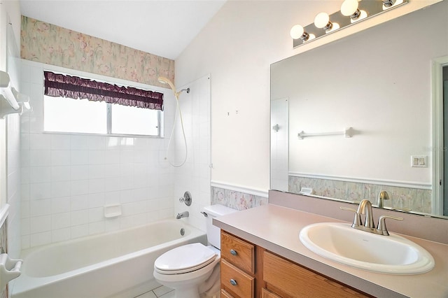 full bathroom featuring vanity, toilet, and tiled shower / bath