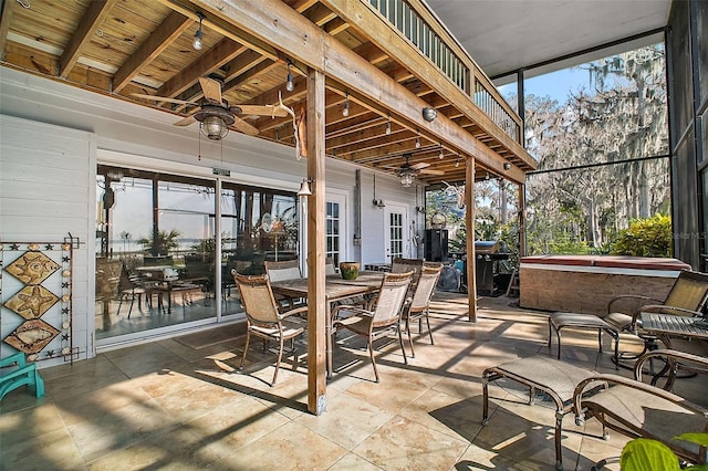 view of patio with a hot tub and ceiling fan