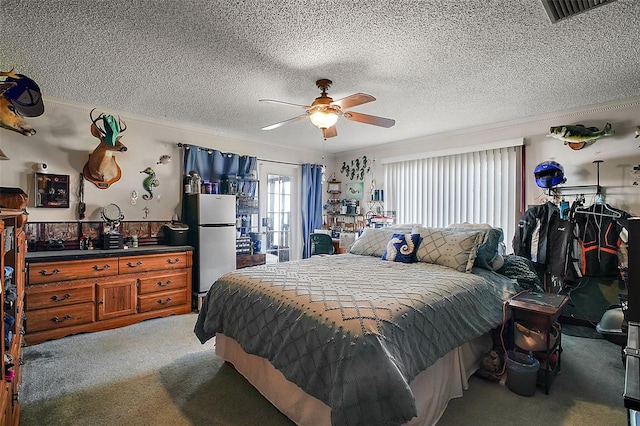 carpeted bedroom featuring crown molding, ceiling fan, stainless steel fridge, and a textured ceiling