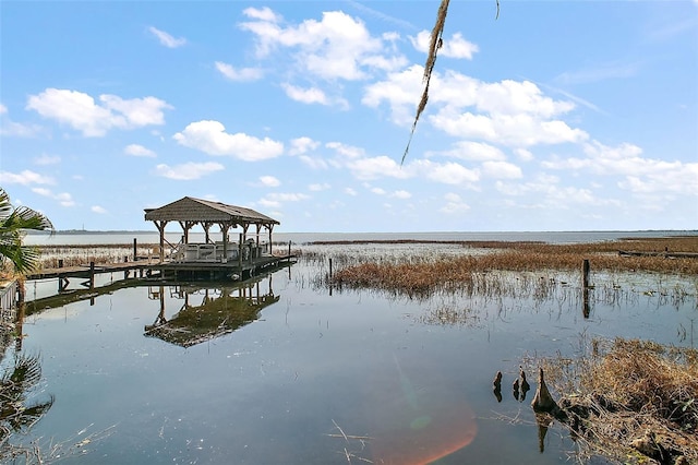 dock area featuring a gazebo and a water view