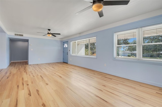 empty room with light hardwood / wood-style flooring and ceiling fan