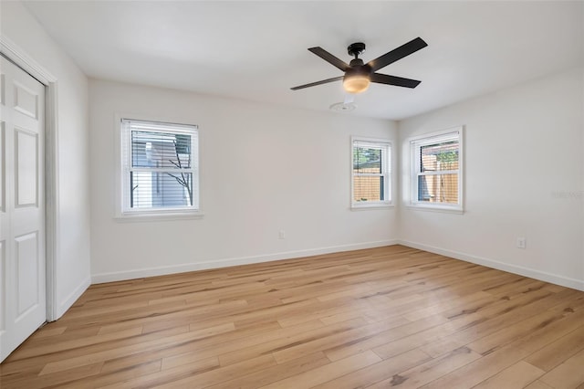 spare room featuring light hardwood / wood-style floors and ceiling fan