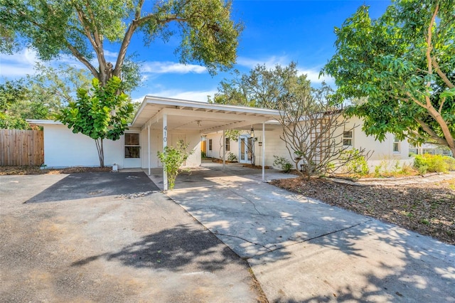 exterior space with a carport