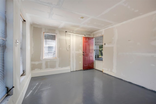 spare room with concrete flooring