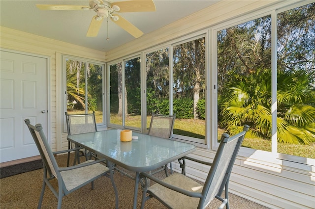 sunroom featuring ceiling fan