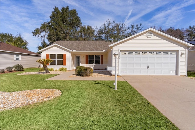 ranch-style home with a garage, a porch, and a front yard