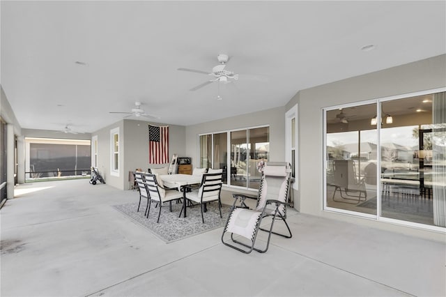 exterior space with concrete flooring and ceiling fan