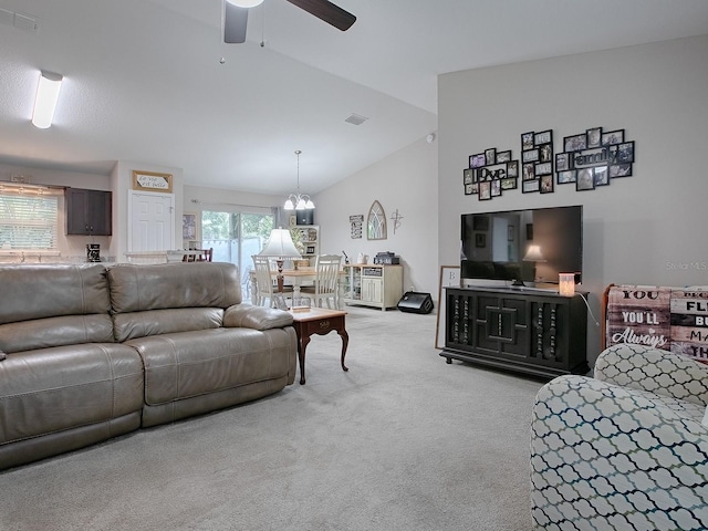 carpeted living room with lofted ceiling and ceiling fan