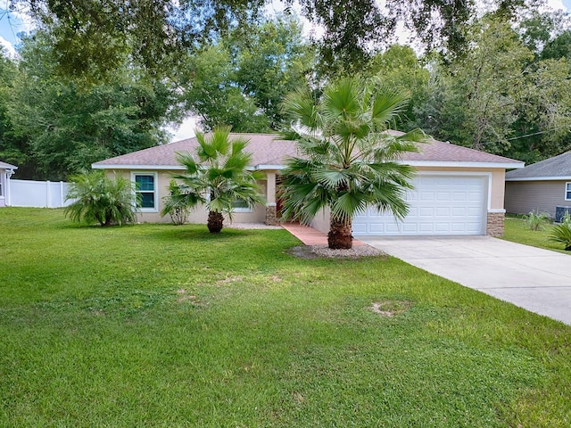 ranch-style house featuring a garage and a front lawn