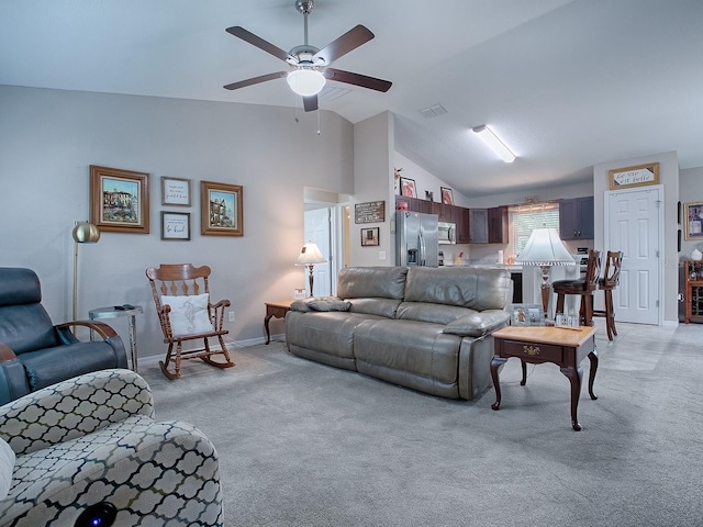 living room with ceiling fan, light colored carpet, and high vaulted ceiling