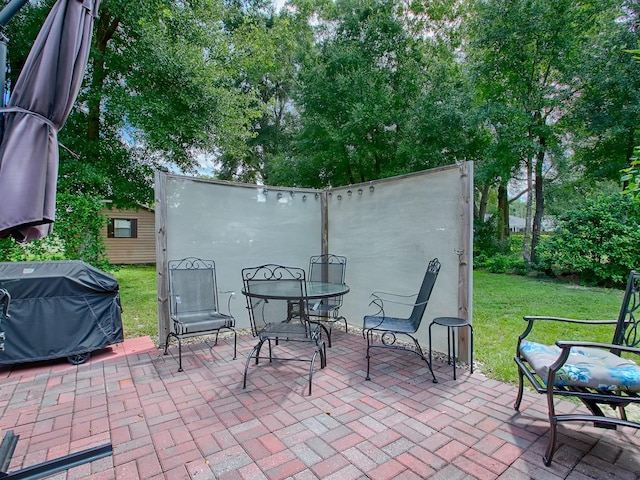 view of patio with a grill