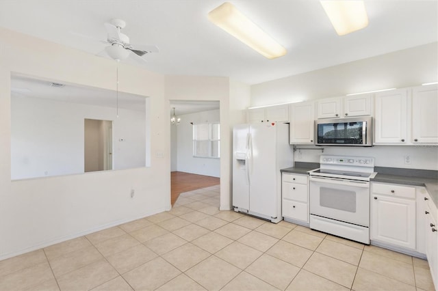 kitchen featuring ceiling fan, white appliances, light tile patterned floors, and white cabinets