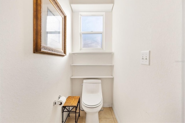 bathroom featuring toilet and tile patterned flooring