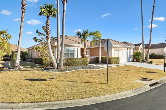 ranch-style house featuring a garage and a front lawn