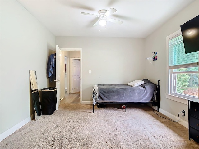 carpeted bedroom featuring ceiling fan